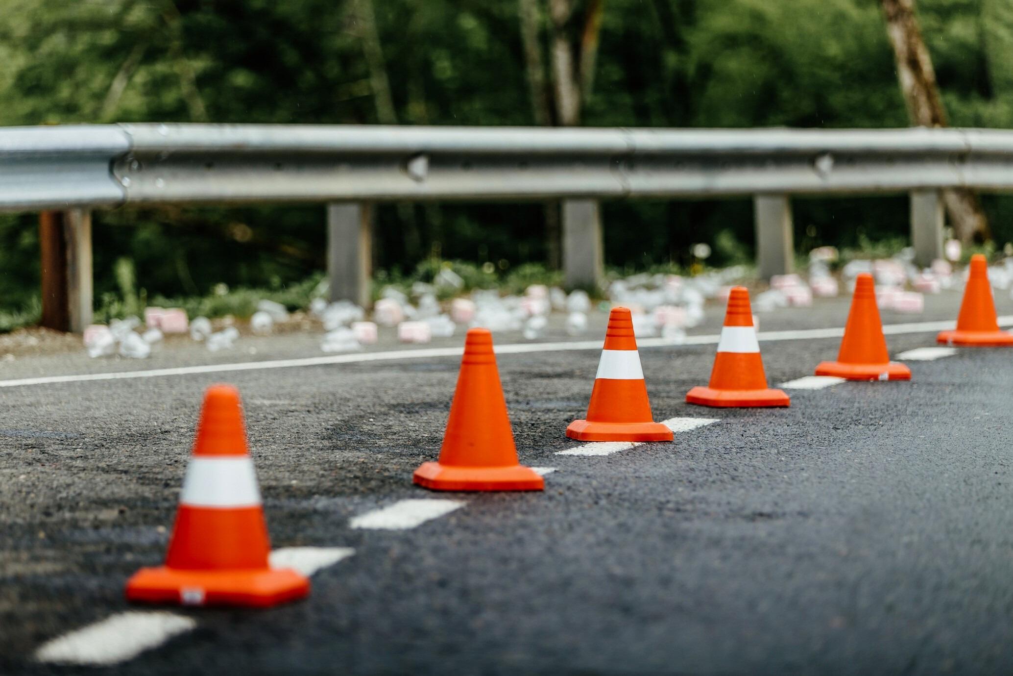 Road risk cover illustrated by traffic cones marking a road, highlighting road safety and potential risks for motor traders.