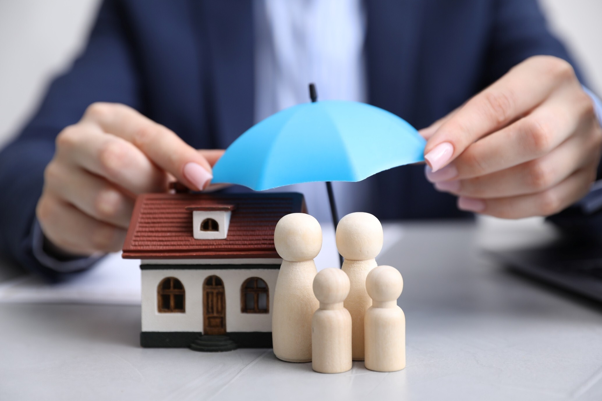 Property underinsurance represented by a family home protected by insurance, highlighting the importance of adequate buildings and contents cover.