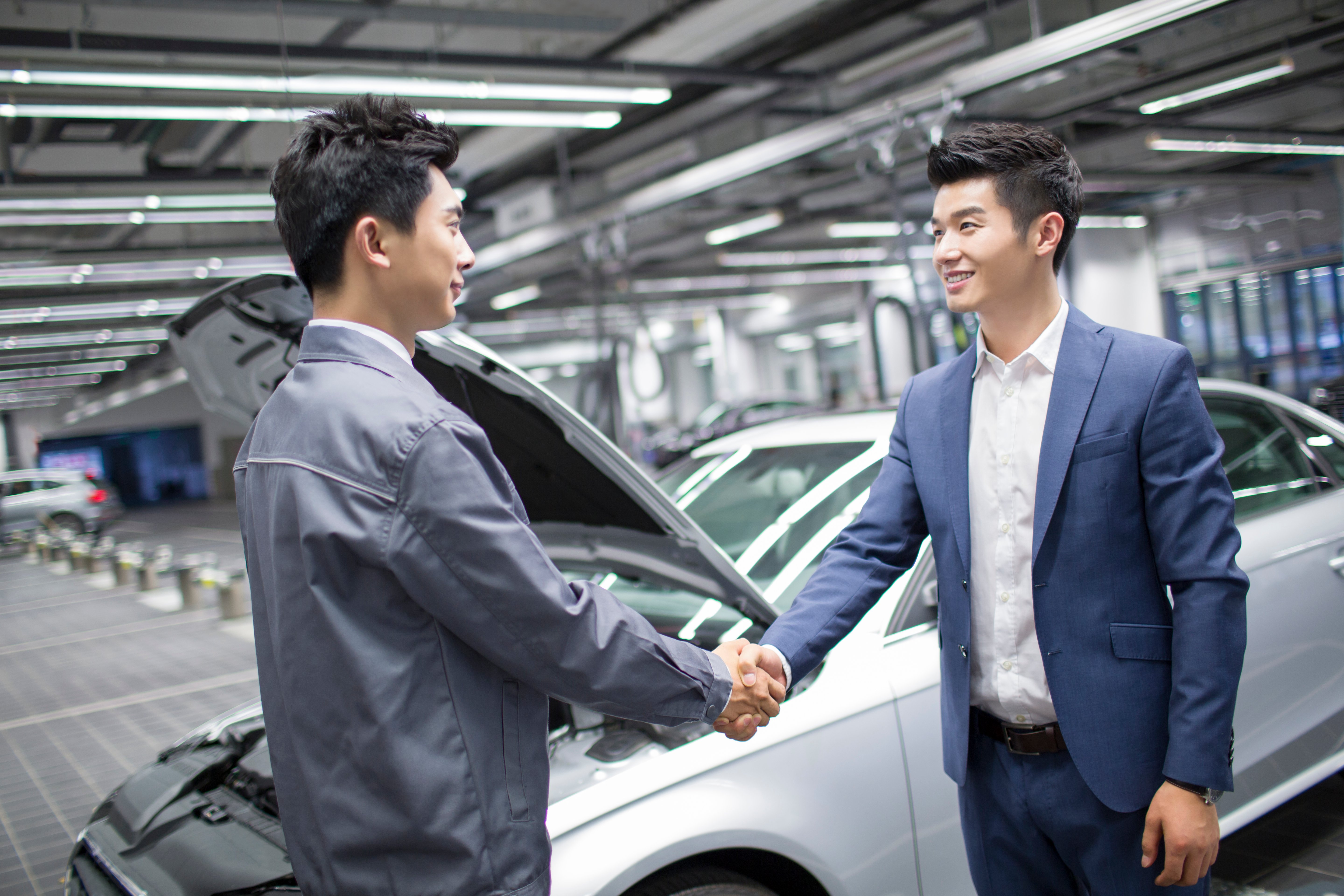 Car dealership or garage environment with multiple vehicles, representing insurance for a motor trader and growing business risk exposure.